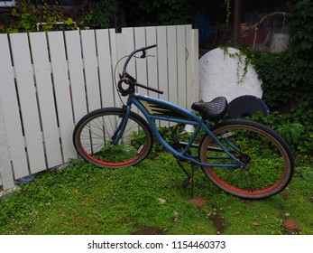 Beach Cruiser Bike With White Fence