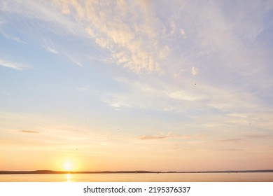 Beach dawn, sunrise. Evening sky with clouds. Golden hours. afternoon vanilla sky. Seashore sunburn or Sunset