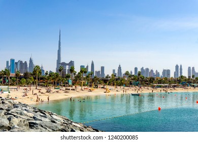 Beach In Dubai With People And Skyscapers In The Background