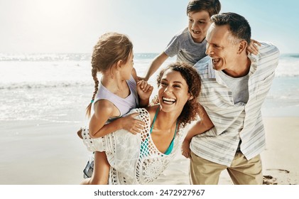 Beach, family and parents piggy back for holiday, fun and together with children for Australia adventure. Summer, ocean and vacation afternoon with happy mother, father and kids laughing in nature - Powered by Shutterstock