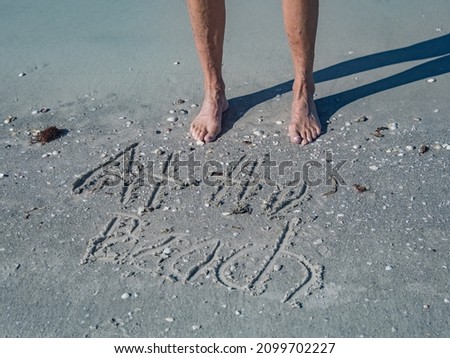 At the beach - feet in the sand 