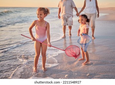 Beach, fishing and children with parents in water for summer vacation, holiday or outdoor growth development and wellness. Happy, excited girl kids and fisherman people or family play with net in sea - Powered by Shutterstock