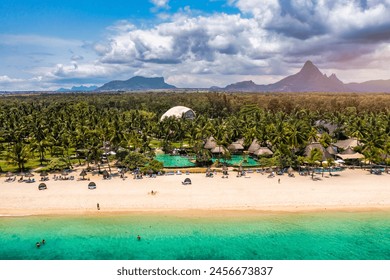 Beach of Flic en Flac with beautiful peaks in the background, Mauritius. Beautiful Mauritius Island with gorgeous beach Flic en Flac, aerial view from drone. Flic en Flac Beach, Mauritius Island. - Powered by Shutterstock