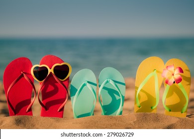 Beach flip-flops on the sand. Summer vacation concept - Shutterstock ID 279026729