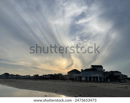 Beach front sunset clouds water