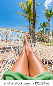 Beach Hammock Vacation Woman Feet Selfie. Girl Relaxing Taking Pov Picture Of Her Legs And Feet Sun Tanning In Tropical Summer Destination. Travel Fun Getaway.