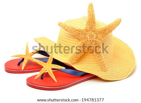 Beach hat, red flip flops with starfishes isolated on white