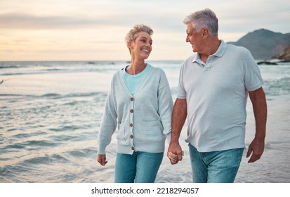 Beach, holding hands and senior couple with sunset for outdoor wellness, retirement holiday and outdoor date mock up sky. Happy elderly people, or old man and old woman walking by sea or ocean water - Powered by Shutterstock