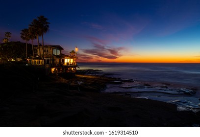 Beach house close to the ocean in San Diego, California. Sunset sky and a beautiful house with ocean view. 