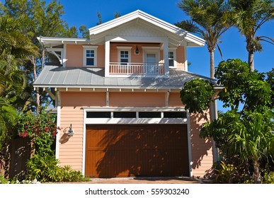 Beach House with Garage and Beautiful Landscaping and Palm Trees. Would Make a Great Vacation Rental Property. 