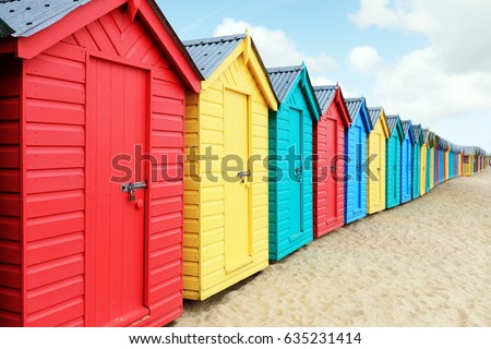 Beach huts or colorful bathing boxes on the beach