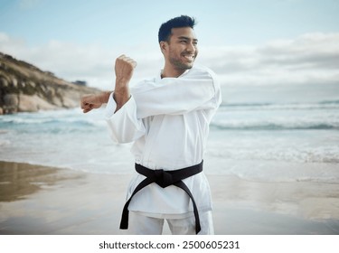 Beach, karate and man with fitness, stretching and ocean with nature, wellness and balance. Healthy person, seaside and guy with training, smile or practice with professional, martial arts and skills - Powered by Shutterstock