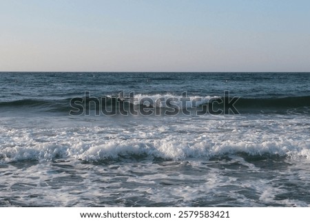 Similar – Image, Stock Photo Waves crashing on the rugged Praia Jalé shoreline