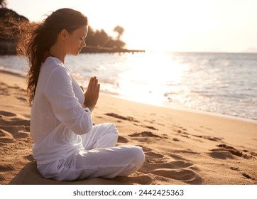 Beach, meditation or woman with prayer hands in nature at sunset for peace, zen or mental health wellness. Spiritual, balance or person at the ocean for energy, breathing or holistic self care at sea - Powered by Shutterstock