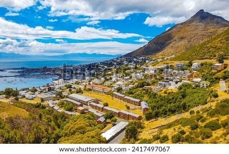 Beach mountains landscape panorama view and blue sky with clouds in Simons Town Cape Town Capetown Western Cape South Africa Southafrica.