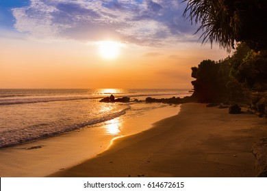 Beach near Tanah Lot Temple in Bali Indonesia - travel background - Shutterstock ID 614672615