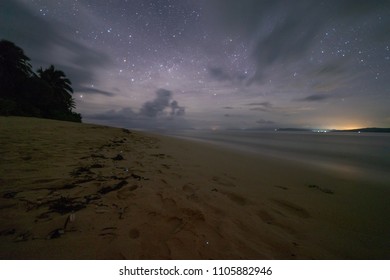 Beach On A Desert Island Of Philippines With Bioluminescent Phytoplankton On The Sand