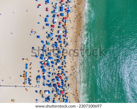 Similar – Luftaufnahme von fliegenden Drohnen der Menschenmenge, die sich am Strand in Rumänien am Schwarzen Meer entspannen.