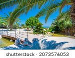 Beach Palms and Resorts on Riviera seafront of San Benedetto del Tronto, Marche, Italy, view on walkway wharf of the port, one of biggest on the Adriatic, most important centre of Riviera of the Palms