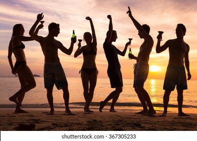 beach party, group of young people dancing, friends drinking beer and cocktails at sunset