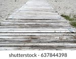 beach path with planks, sand and text space