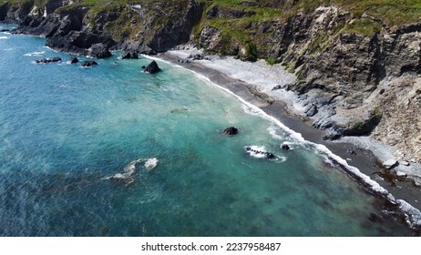 Beach with pebbles on the shore of the Celtic Sea, south of Ireland, top view. Beautiful seaside landscape. The water is turquoise in color. Drone photo. - Shutterstock ID 2237958487