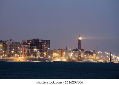 Beach promenade with lighthouse, Scheveningen, The Hague, Holland, The Netherlands
