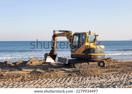 Beach renovation with heavy excavator machine