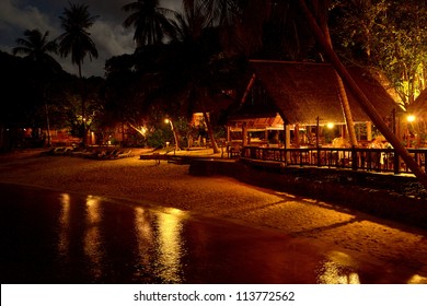 A Beach Restaurant By Night In Thailand