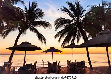 Beach Restaurant At Sunset On Tropical Island