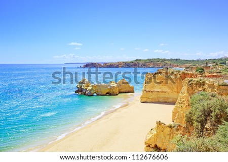 Beach and rock formation known as Praia da Rocha in travel destination Portimao. Algarve, Portugal, Europe.