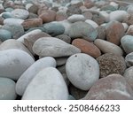 Beach rock pile with grime. Small and big rocks. Dark and bright rocks. Rock texture

