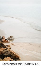 Beach And Rocks In Morro Bay Volcanic Formation California. Yellow Beige Monochrome Nature Marine Landscape