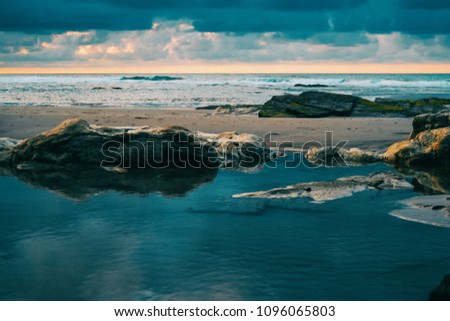 Similar – Image, Stock Photo Beach with rocks and puddle in a sunset, ribadeo, lugo, galician, spain