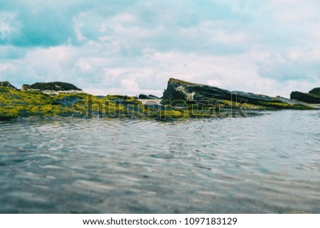 Similar – Foto Bild Strand mit Felsen und Pfütze im Sonnenuntergang, Ribadeo, Lugo, Galizien, Spanien