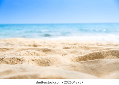 Beach sand background for summer vacation concept. Beach nature and summer seawater with sunlight light sandy beach Sparkling sea water contrast with the blue sky. - Shutterstock ID 2326048957