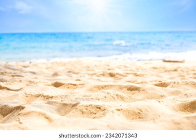Beach sand background for summer vacation concept. Beach nature and summer seawater with sunlight light sandy beach Sparkling sea water contrast with the blue sky. - Shutterstock ID 2342071343
