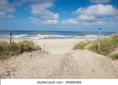 Beach With Sand Dunes And A Path To The Sea