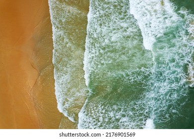 Beach Sand Sea Shore And Waves White Foamy Summer Sunny Day Background.Amazing Beach Top Down View Overhead Seaside Nature Background