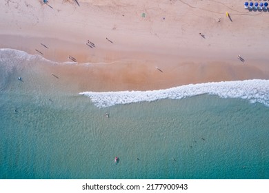 Beach Sand Sea Shore And Waves White Foamy Summer Sunny Day Background.Amazing Beach Top Down View Overhead Seaside Nature Background