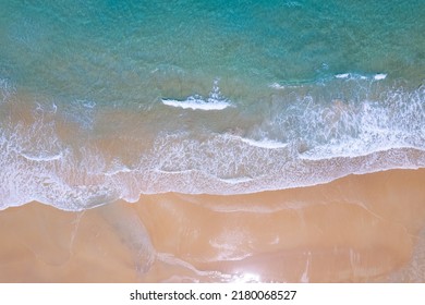 Beach Sand Sea Shore And Waves White Foamy Summer Sunny Day Background.Amazing Beach Top Down View Overhead Seaside Nature Background