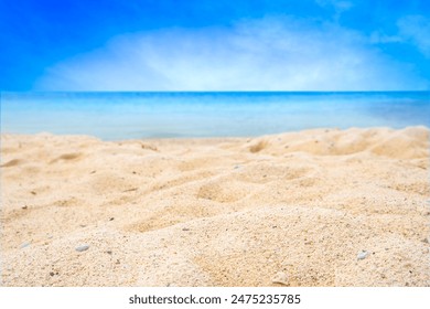 Beach sand for summer vacation concept. Beach nature and summer seawater with sunlight light sandy beach Sparkling sea water contrast with the blue sky.