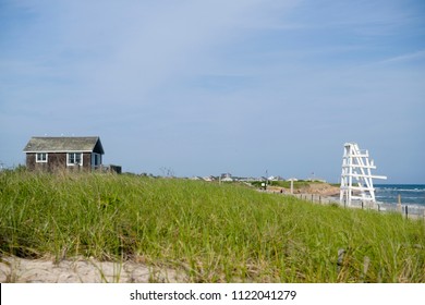 Beach Scene With Beach House Scrub Brush And Lifeguard Chair On Ditch Plains Beach Montauk, New York, The Hamptons