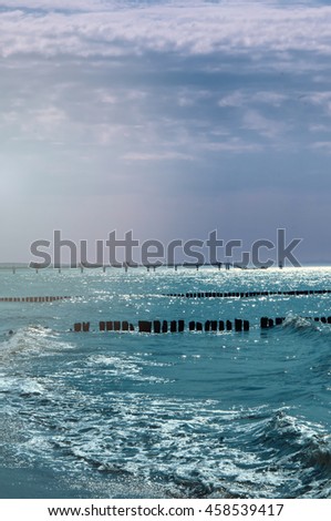 Similar – wooden platform with blue posts with ropes and orange lifebuoys on the background of the sea and sky with clouds Egypt Dahab South Sinai