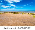 The beach at Seahouse on the North East coast with the Farne islands