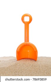 Beach Shovel Stuck In The Sand On A White Background