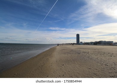 beach with skyscraper in the background