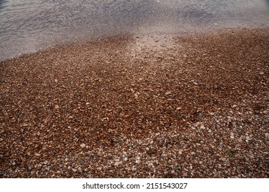 Beach With Small Pebbles And Clear Water. An Idealistic Seascape.