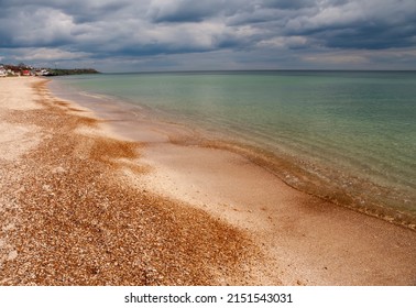 Beach With Small Pebbles And Clear Water. An Idealistic Seascape.