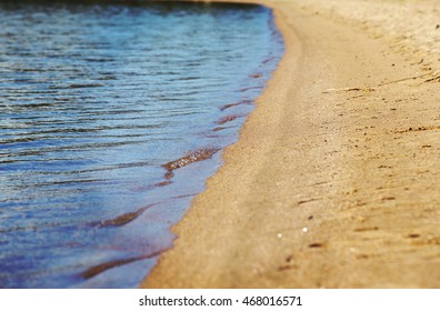 The beach with small waves. Image has a vintage effect applied.